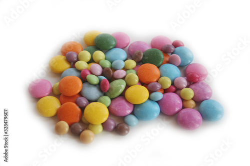 Bunch of chocolate candies with coloful glazes isolated on white background