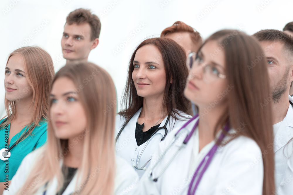 close up. a group of medical professionals putting their hands together close up. a group of medical professionals putting their hands together