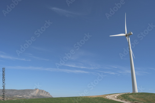 Back view of a wind turbine a sunny day photo