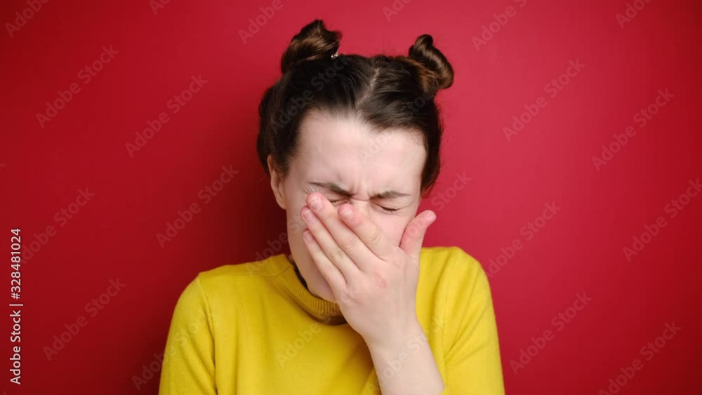 Sick unhealthy young woman feel unwell coughing, ill girl suffer from flu or fever having health problems barking and sneezing, dressed yellow sweater, isolated on red studio background. Sick unhealthy young woman feel unwell coughing, ill girl suffer from flu or fever having health problems barking and sneezing, dressed yellow sweater, isolated on red studio background.