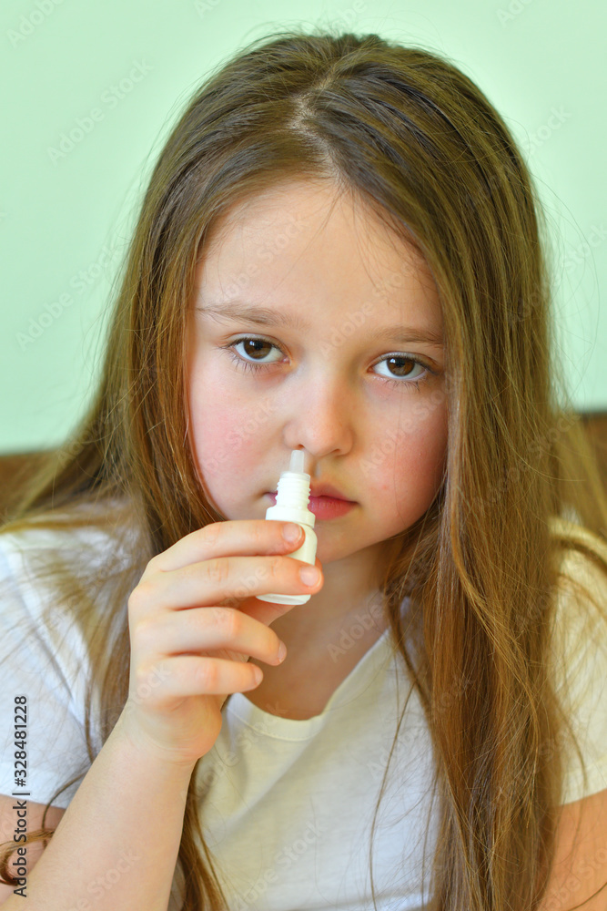 Little child girl blow his nose.Sick child with napkin in bed. Allergic kid, flu season. Kid with cold rhinitis, get cold snot nose. virus and infection Little child girl blow his nose.Sick child with napkin in bed. Allergic kid, flu season. Kid with cold rhinitis, get cold snot nose. virus and infection