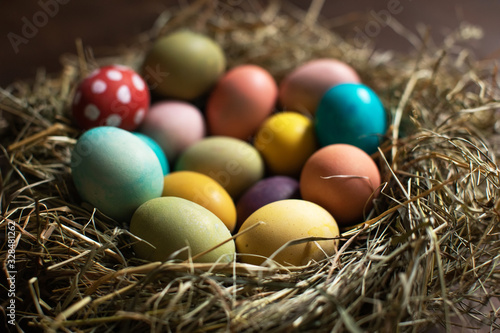 Happy Easter! Colorful easter eggs in a nest