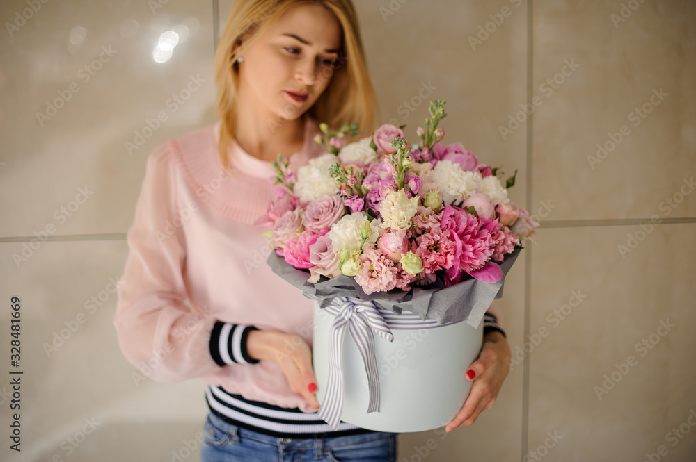 Stylish bouquet made of different pink and white flowers in woman hands. Stylish bouquet made of different pink and white flowers in woman hands.