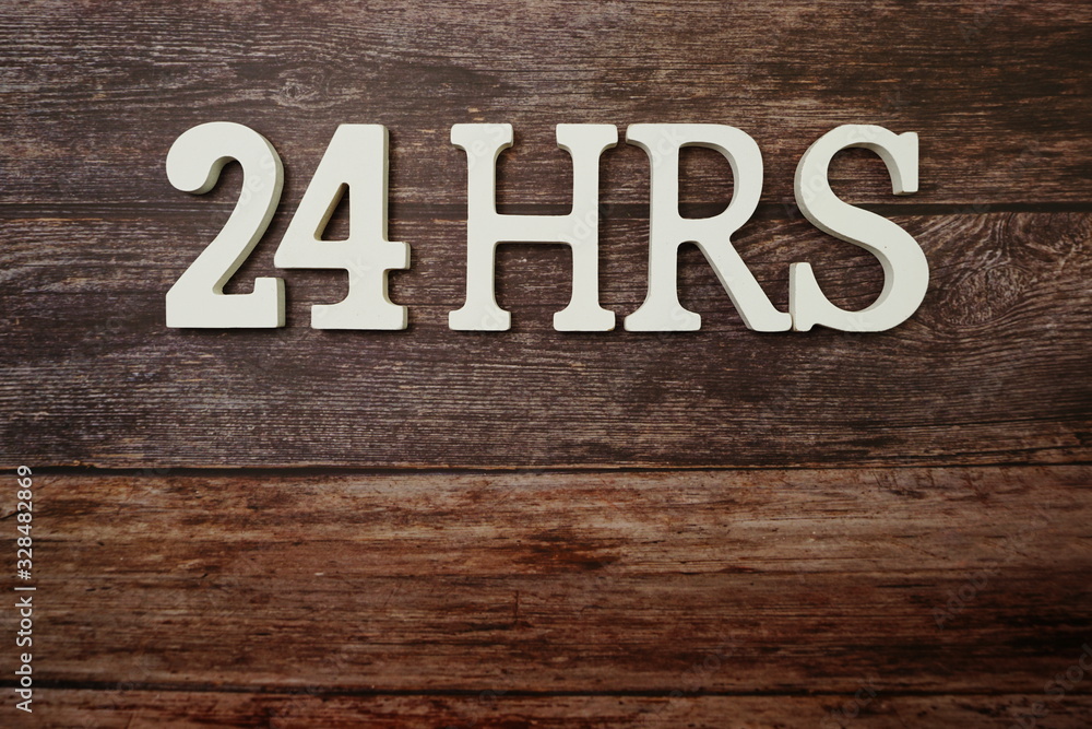 24 HRS alphabet letters with space copy on wooden background 24 HRS alphabet letters with space copy on wooden background