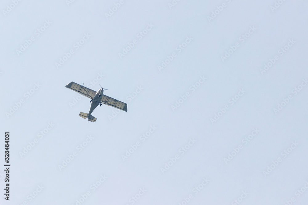 Ultralight plane flies over Pokhara and Annapurna region in Nepal. Copy space for advertising and design Ultralight plane flies over Pokhara and Annapurna region in Nepal. Copy space for advertising and design