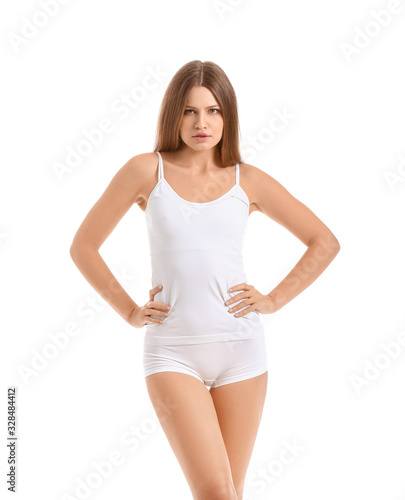 Beautiful young woman in underwear on white background © Pixel-Shot