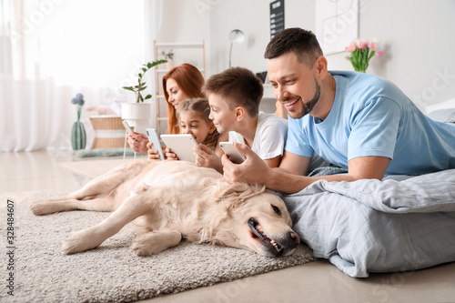 Happy family with modern de...