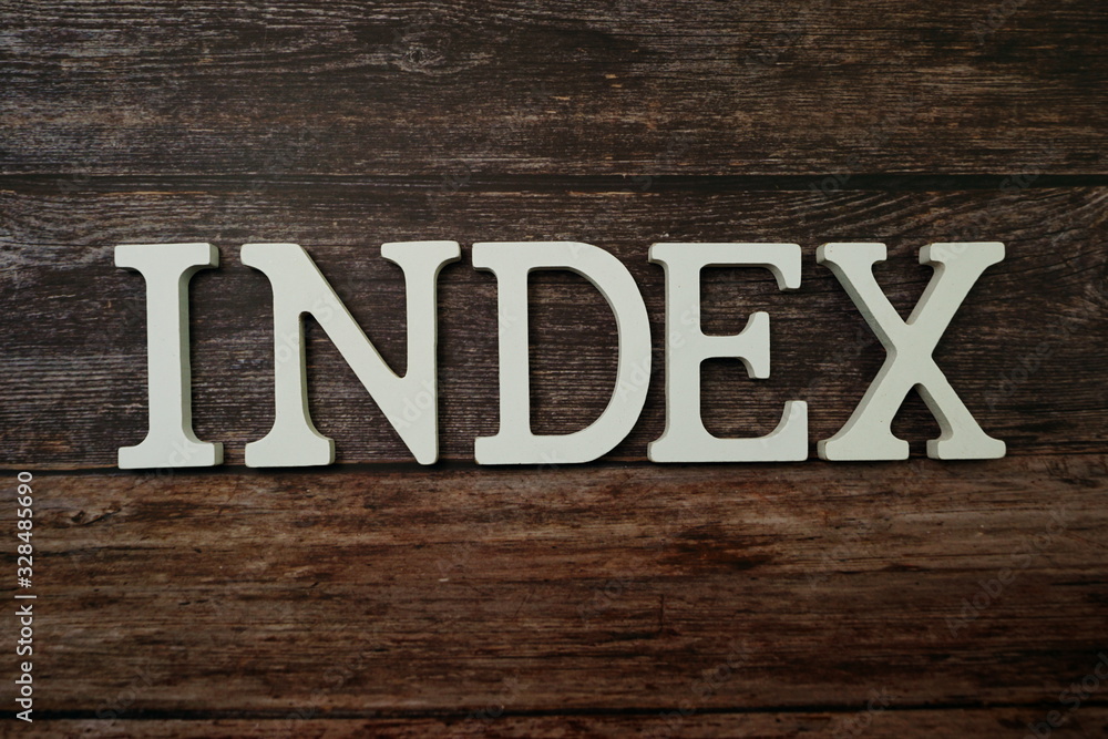Index alphabet letter on wooden background