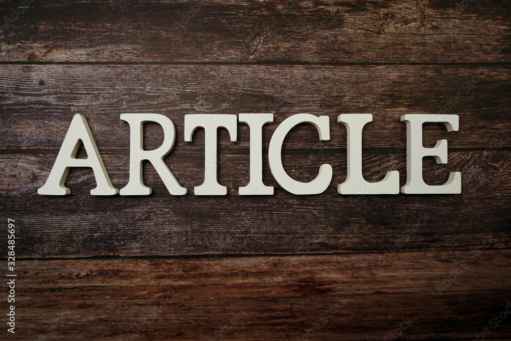 Article alphabet letter on wooden background Article alphabet letter on wooden background
