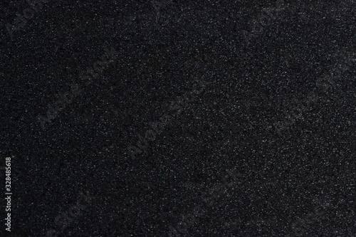 Dark black wall texture background.
