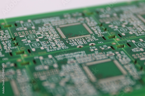 Multiplied printed circuit boards PCB isolated on the white background. PCB assembly. Close-up view