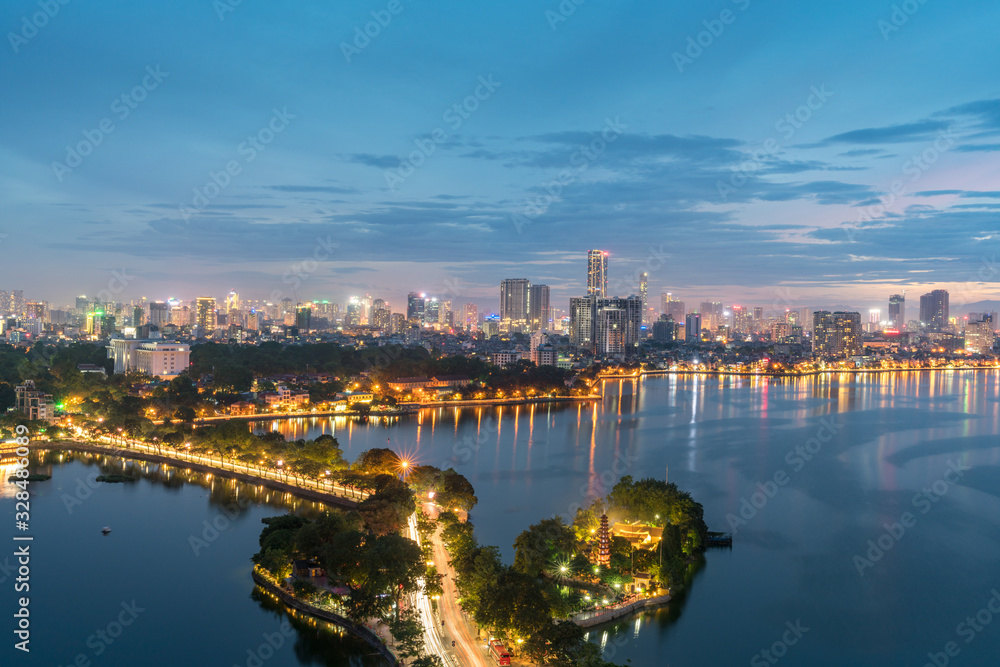 Fototapeta premium Aerial view of Hanoi skyline at West Lake or Ho Tay. Hanoi cityscape at twilight