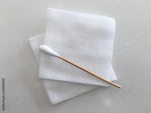 swab and gauze for medical wound dressing on white photo