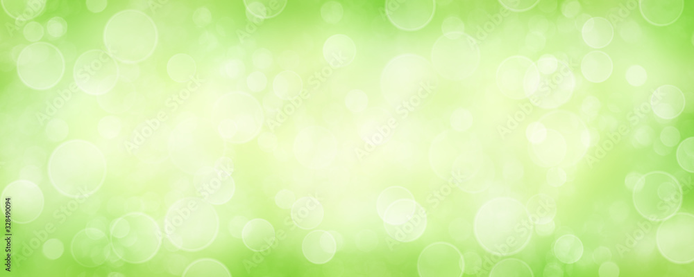 Spring background with green blurred bokeh lights. Spring background with green blurred bokeh lights.