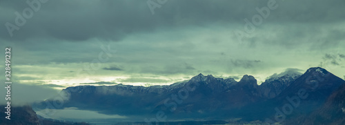 soft focus on snowy peak Alps mountain panoramic landscape scenic view moody depressive foggy weather time