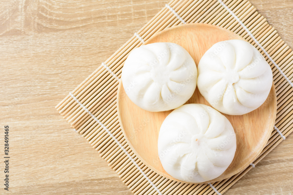 Steamed buns on wooden plate ready to eating, Asian food, Top view