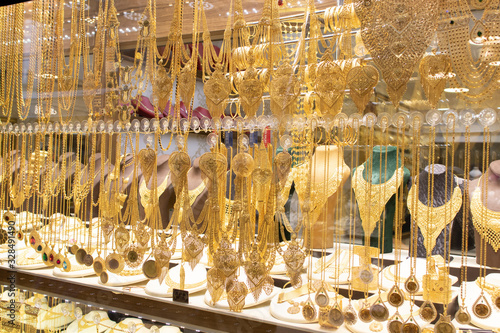 Gold necklaces and bracelets designed in various ways in front of the store.