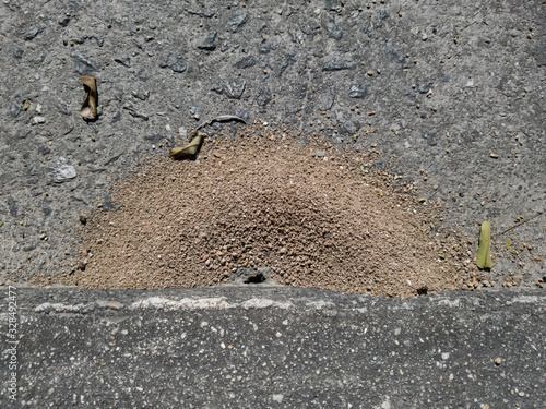 Tingling on the cement sidewalk, this is in the shape of a semi circle, or half moon. Interesting adaptation to space possible to use. photo