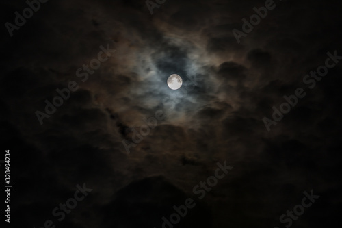 Moon in dark clouds