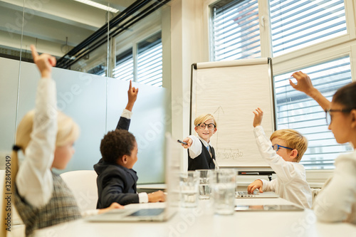 Business kids at presentation in consulting workshop photo