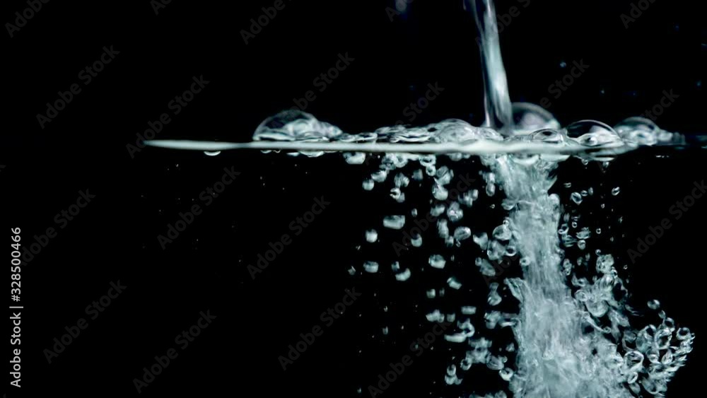 water splashing into water- slow motion water splashing into water- slow motion