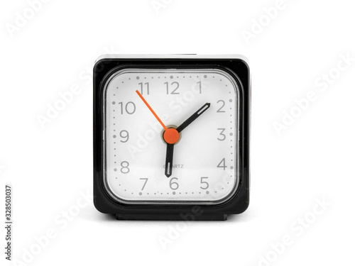 a black square clock with a red arrow facing the camera on a white background