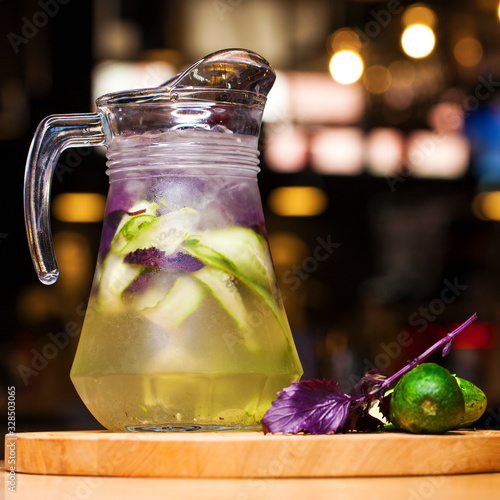 Restaurant dish - soft drink in a jug in dark photo