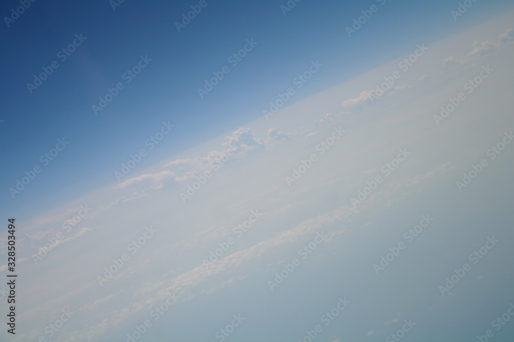 clouds and blue sky seen from plane