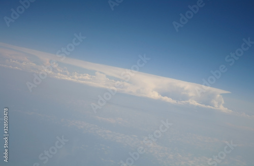 clouds and blue sky seen from plane © ekulik2011