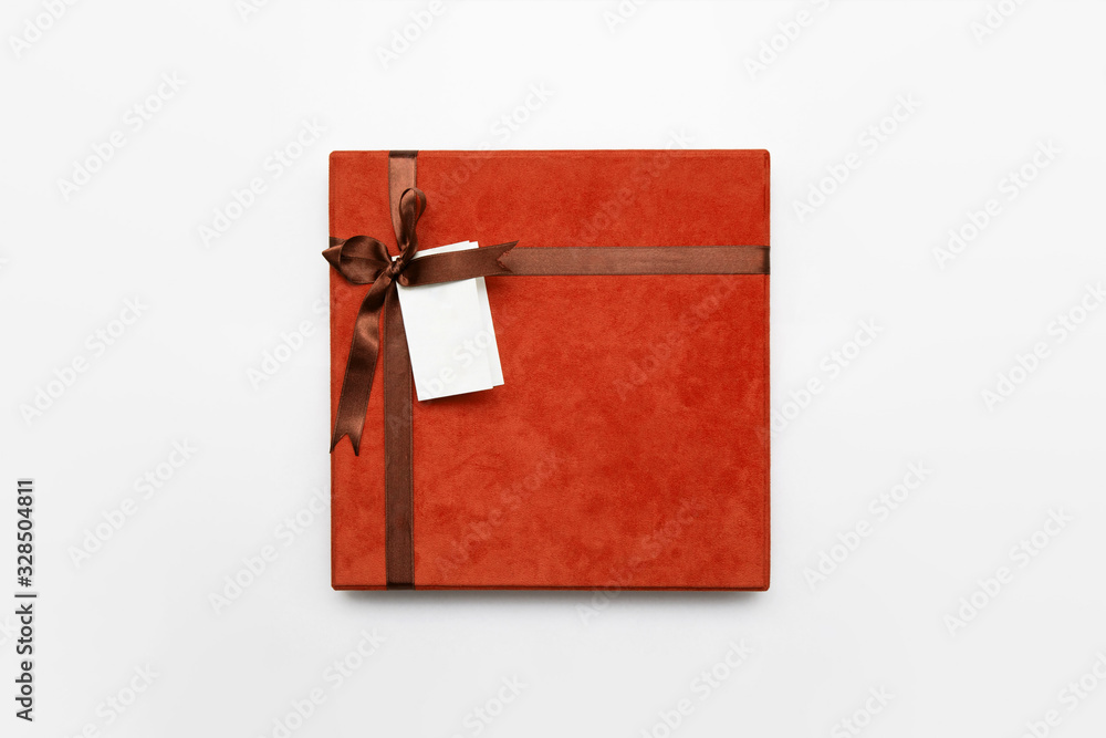 Gift Box with ribbon and name Tag isolated on white background.High ...