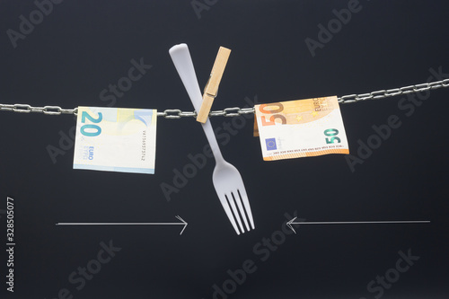 Fotografie Paper money of legal tender; money in a chain