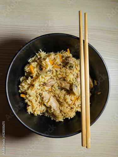 A bowl of takikomi gohan, Japanese mixed rice. photo