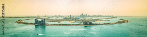 panoramic view of Dubai Palm Jumeirah and Downtown skyline at sunset