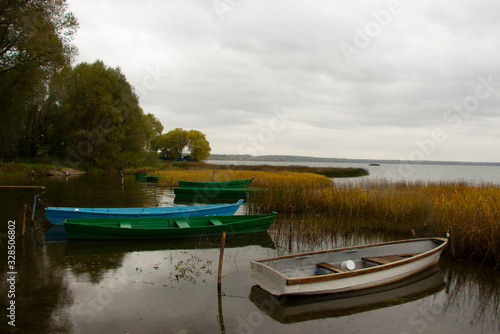 Wooden fishing boats on an autumn decline at the coast of the lake Pleshcheevo in the city of Pereslavl-Zalessky