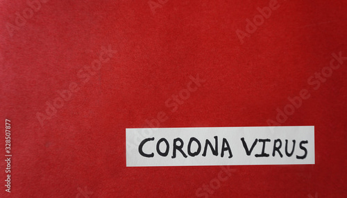  Notepad with words CORONA VIRUS and medicines on red background, flat lay. Space for text