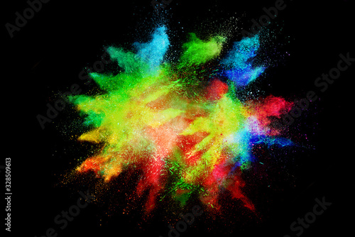 Celebrate festival Holi. Indian Holi festival of colours. Colorful powder explosion on black background. © piyaphong