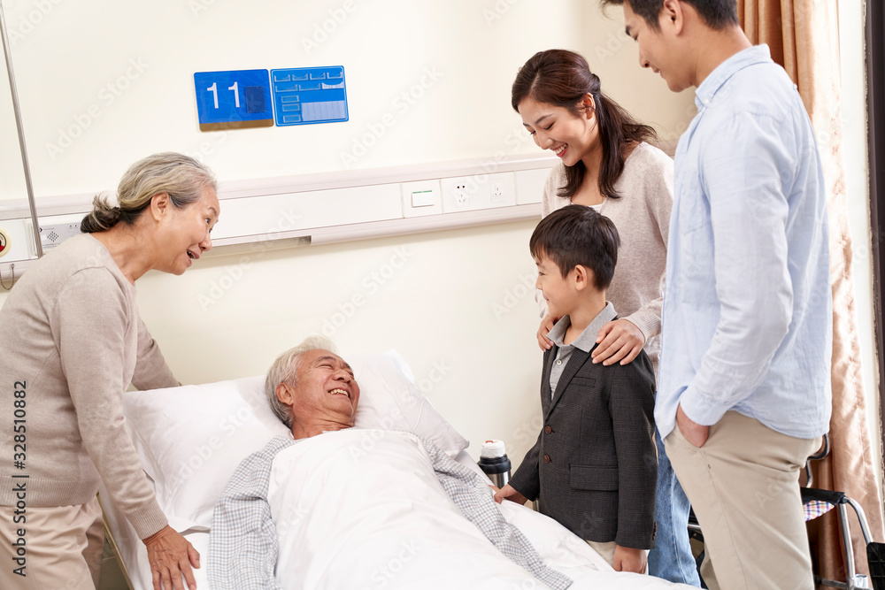 young asian couple and son visiting grandfather and grandmother in hospital young asian couple and son visiting grandfather and grandmother in hospital