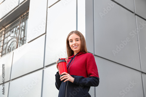Young sporty woman with pro...