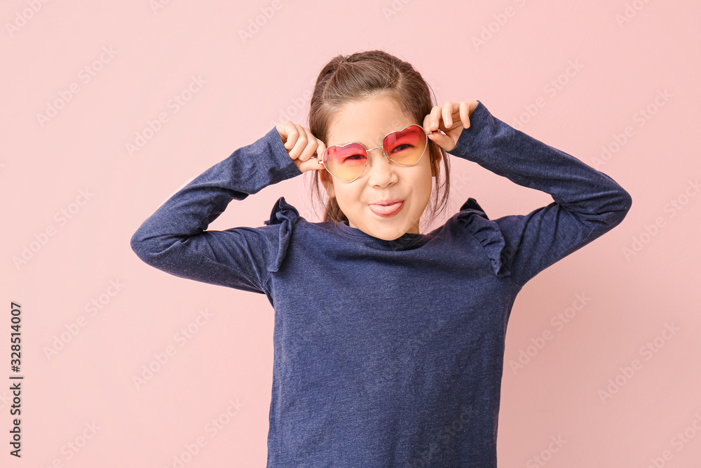 Funny little girl with sunglasses on color background Funny little girl with sunglasses on color background