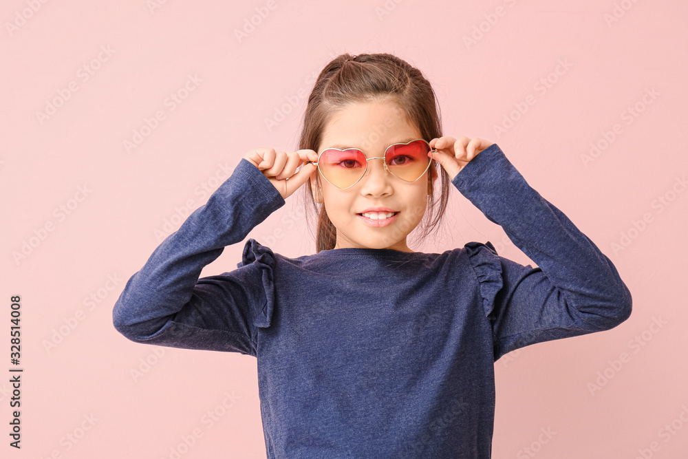 Funny little girl with sunglasses on color background Funny little girl with sunglasses on color background