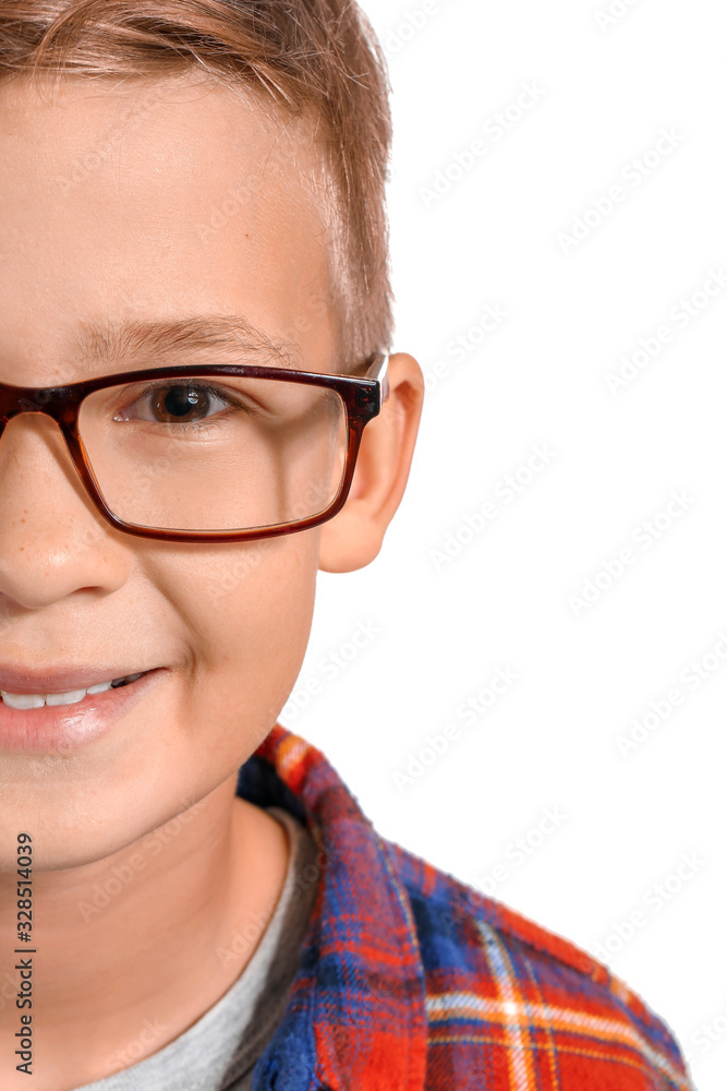 Cute little boy with eyeglasses on white background, closeup