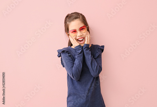 Funny little girl with sung...