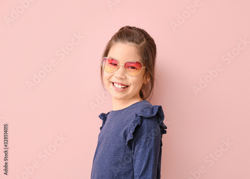 Funny little girl with sung...