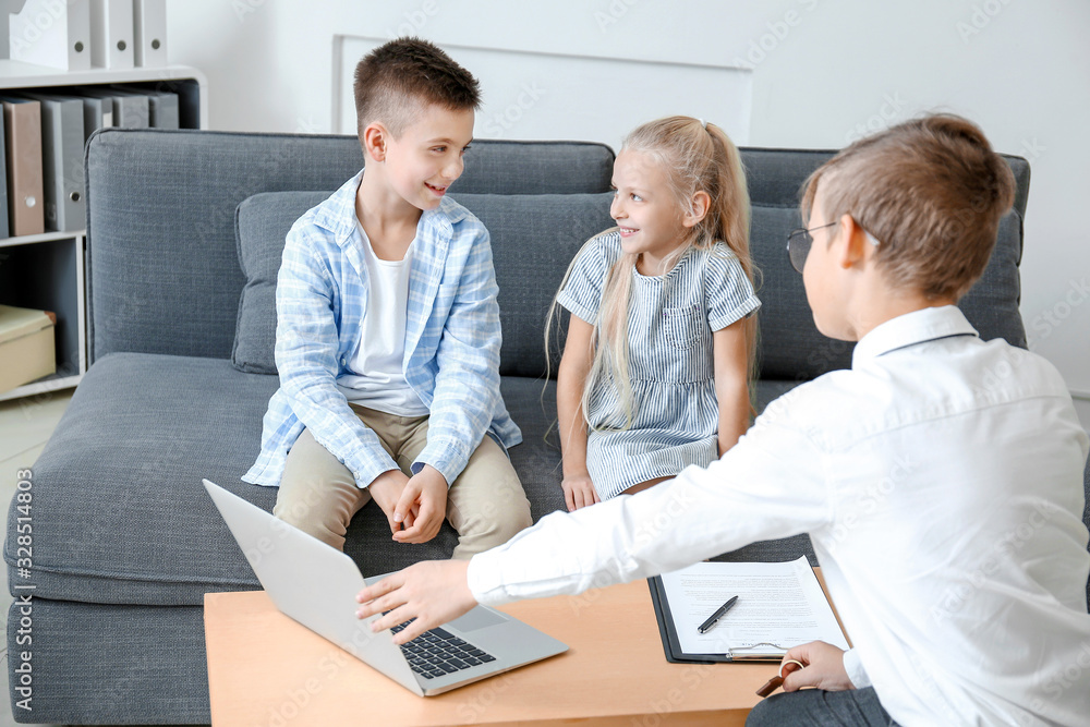 Little real estate agent working with clients in office Little real estate agent working with clients in office