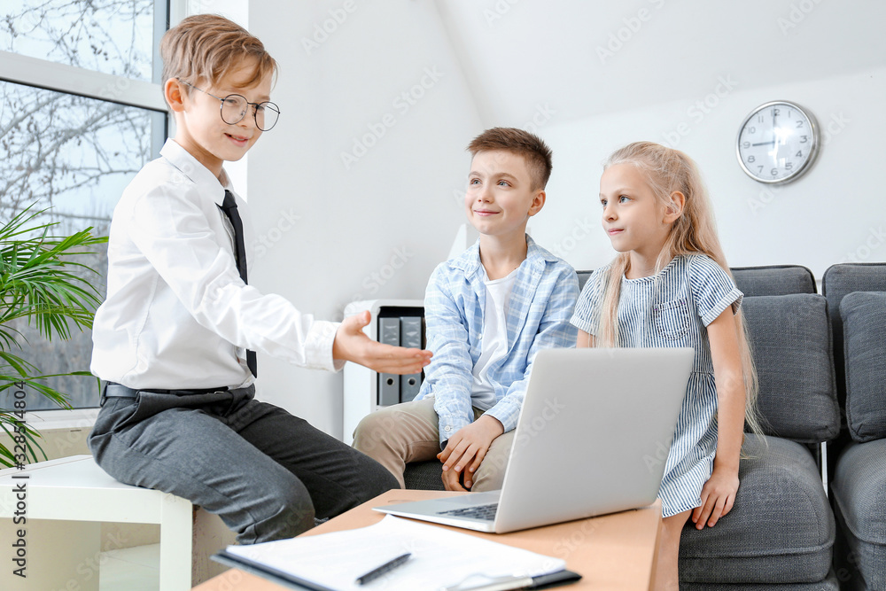 Little real estate agent working with clients in office Little real estate agent working with clients in office