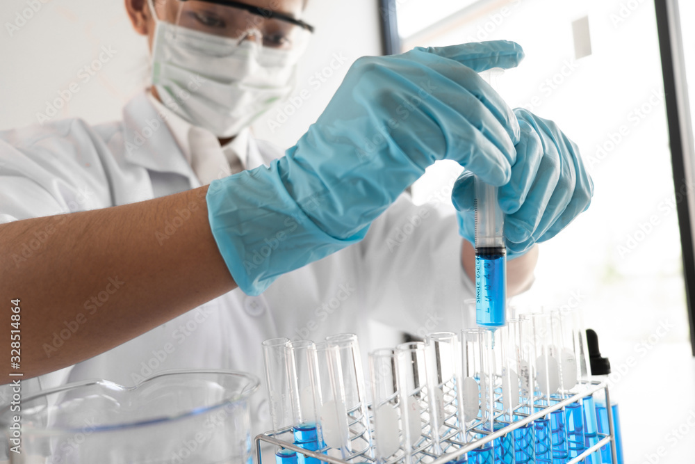 Female scientist are experimenting in the laboratory. Female scientist are experimenting in the laboratory.