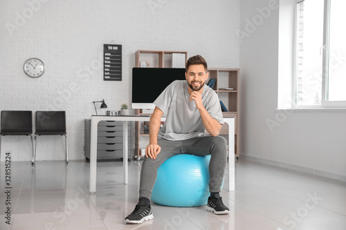 Man doing exercises with fi...