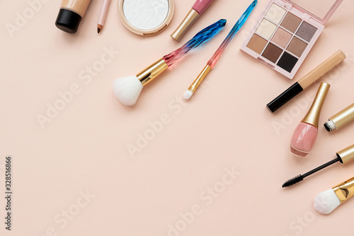 Border from cosmetics and accessories on pink background. Copy space. Flat lay. Top view. Skin care or morning routine concept