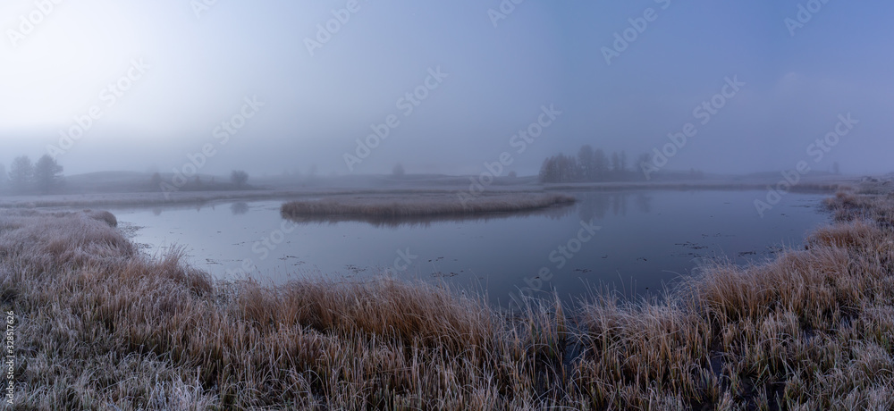 Foggy morning on a mountain lake
