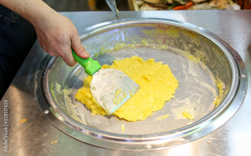 Making fried ice cream from mango and banana